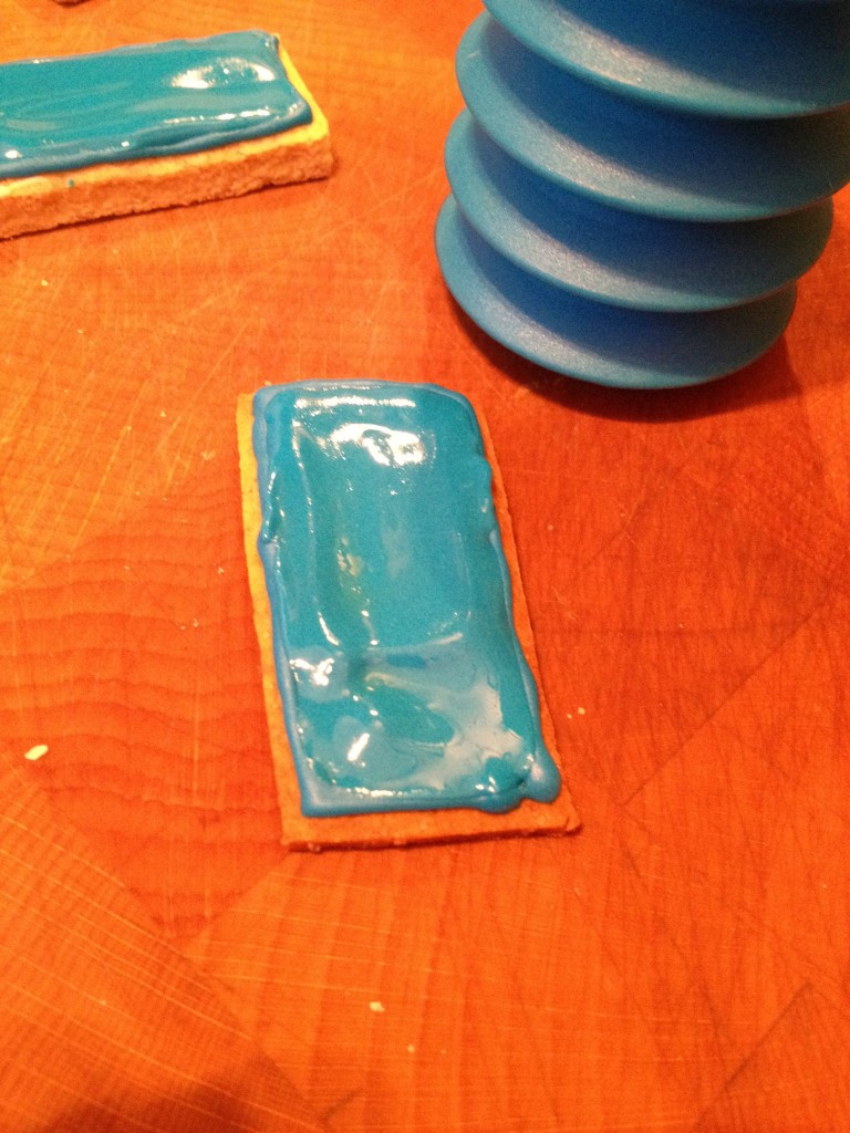 icing a lego biscuit