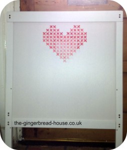 cross stitch mural on furniture