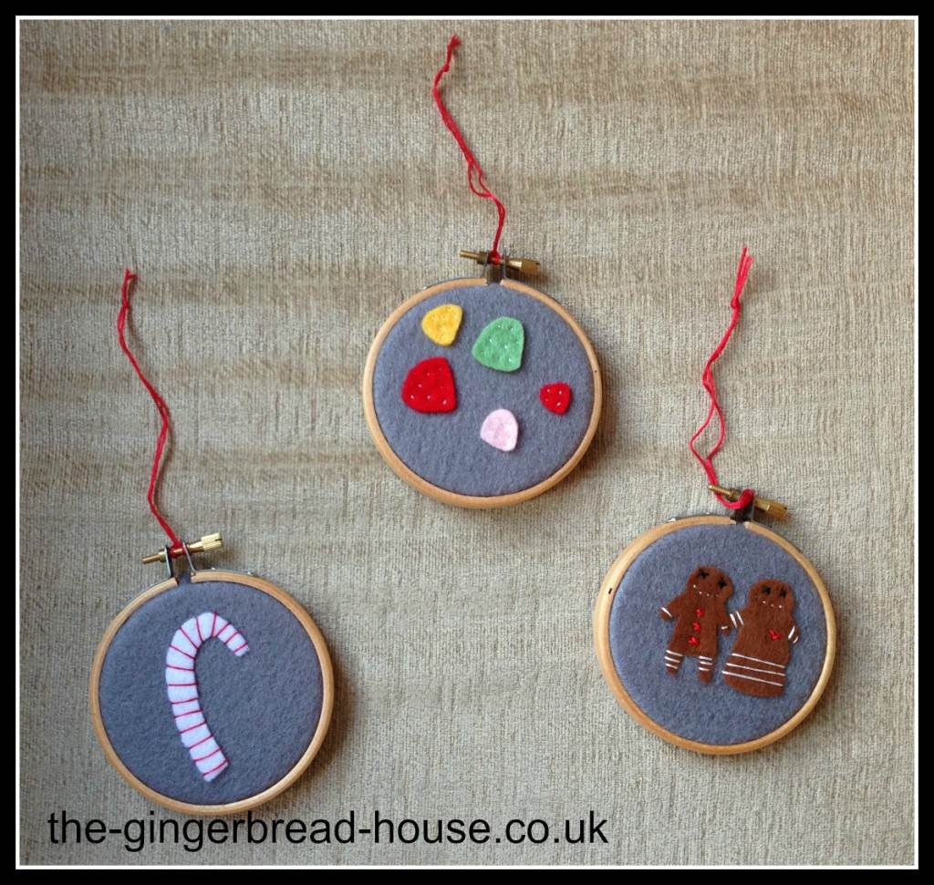 three framed felt decorations