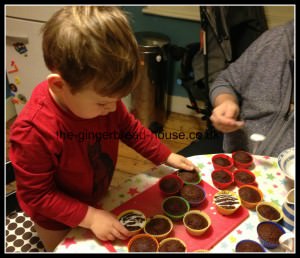 toddler baking toddler baking at a table