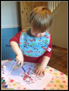 toddler painting toddler painting at a table