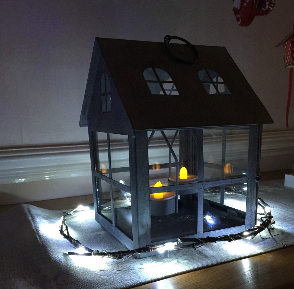 Winter solstice wreath and house-shaped tea light holder