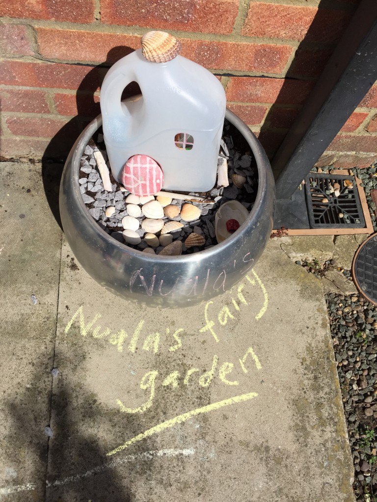 kid friendly fairy garden in a plant pot - holly be tells