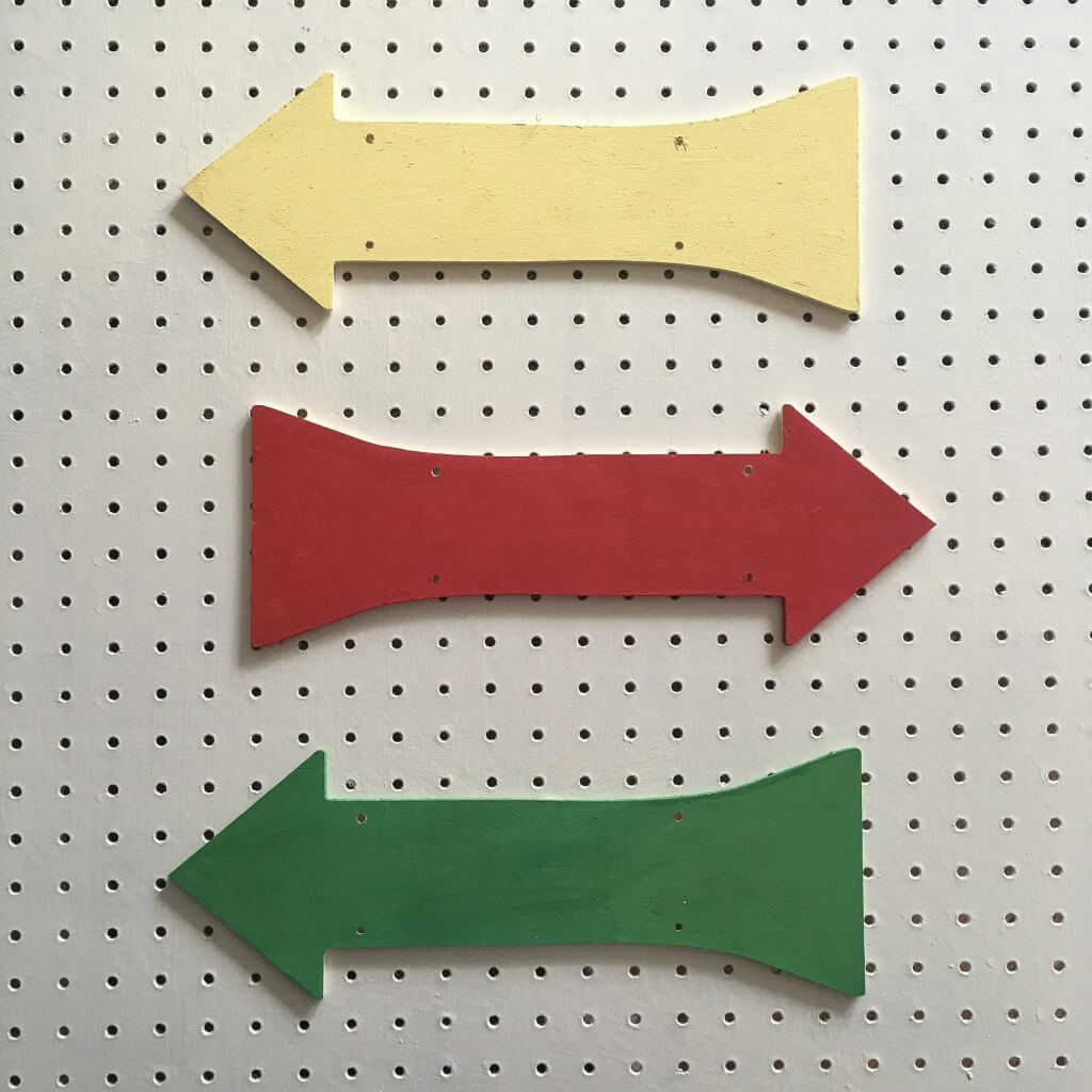 arrow-shaped wooden plaques