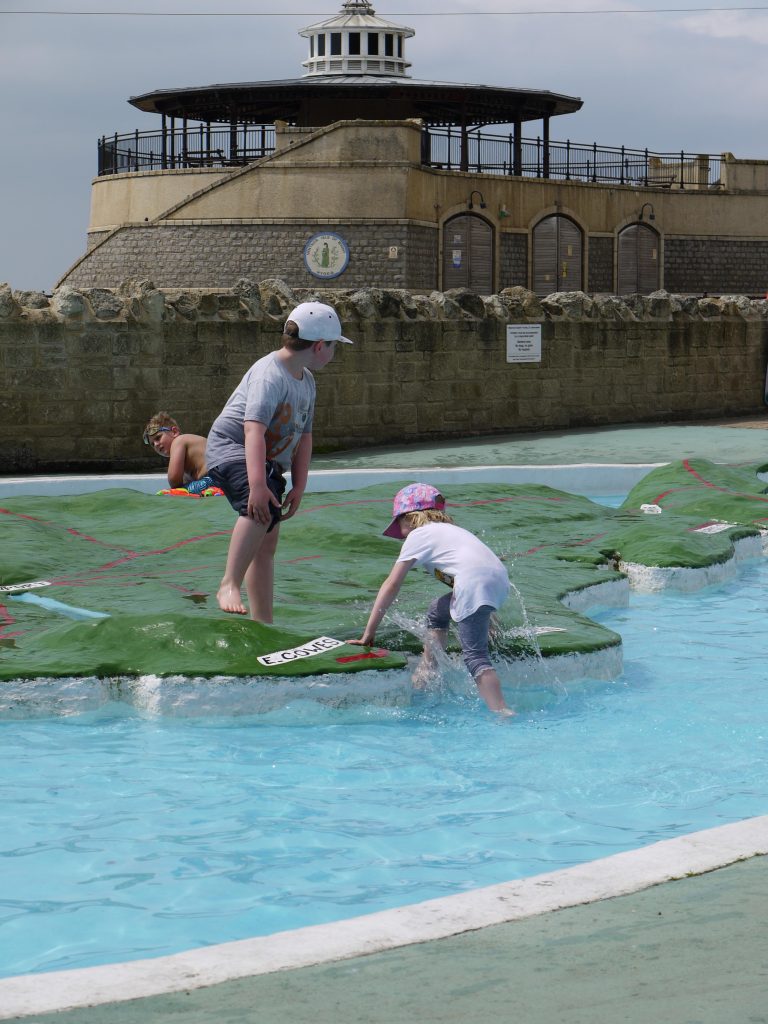 two children paddling