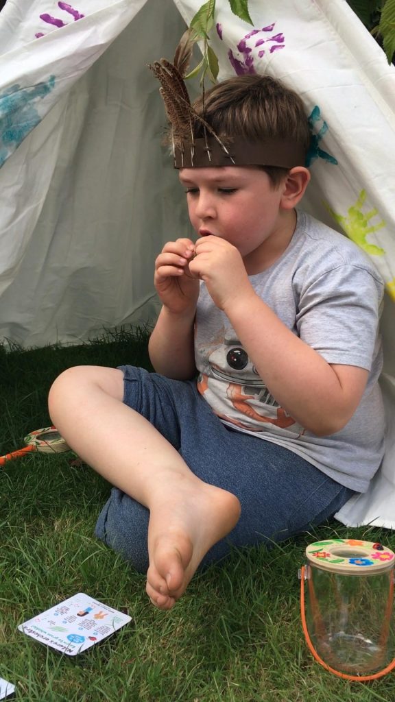 blowing a blade of grass