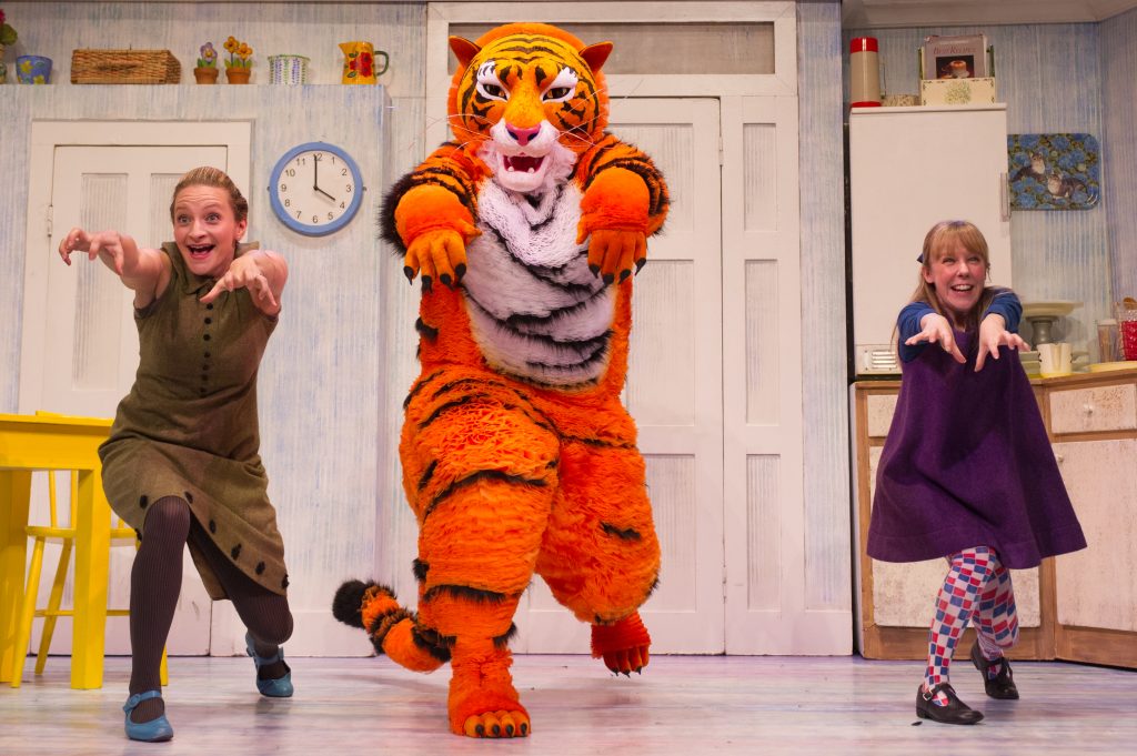 London, UK. 03.07.2014. THE TIGER WHO CAME TO TEA roars into the West End. Adapted from Judith Kerr's book, and directed by, David Wood, the children's show opens at the Lyric Theatre, Shaftesbury Avenue. Abbey Norman plays the little girl, Sophie, Jenanne Redman, her mummy, and Matthew Dudley, the tiger, Sophie's daddy, the Milkman and the Postman. Photograph © Jane Hobson.