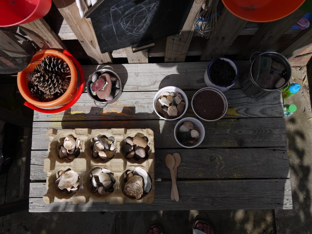 a beach themed mud kitchen Invitation to play 