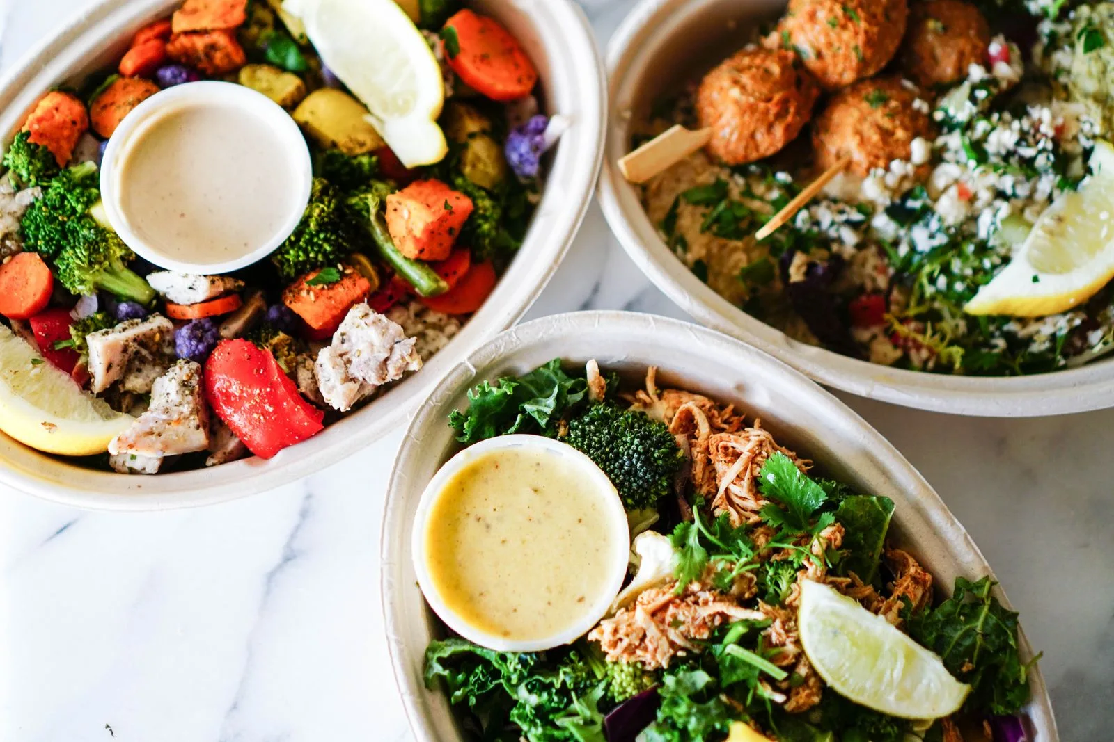 Prepared vegetables and sauces arranged in bowls