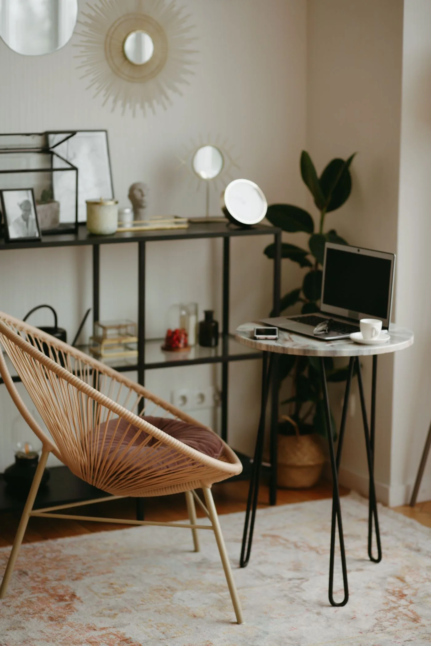 A home desk, chair, lamp and open shelving